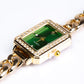 Pozlacená slitina - Hodinky se Smaragdem - Karátové číslo: 0.01.